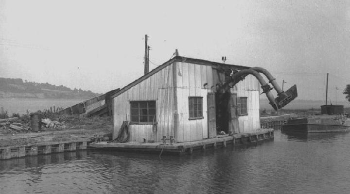 Dredger hoppers & unloading stage on canal at Purton